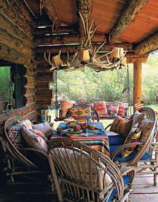 western outdoor decorating ideas. Picture of dining area with antler chandelier and bent willow chairs