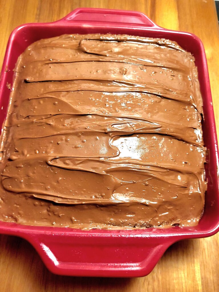 A pan of banana cake with Nutella frosting