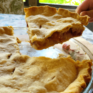 taking a slice out of a rhubarb pie. An old fashioned rhubarb pie recipe