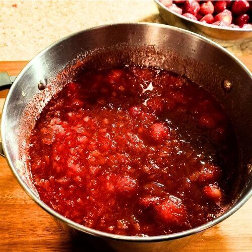 cooked strawberry rhubarb jam recipe in a pot