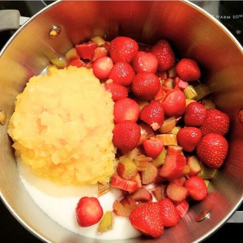 strawberry rhubarb jam ingredients in a pot 