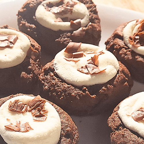 chocolate and marshmallow cookies on a plate.