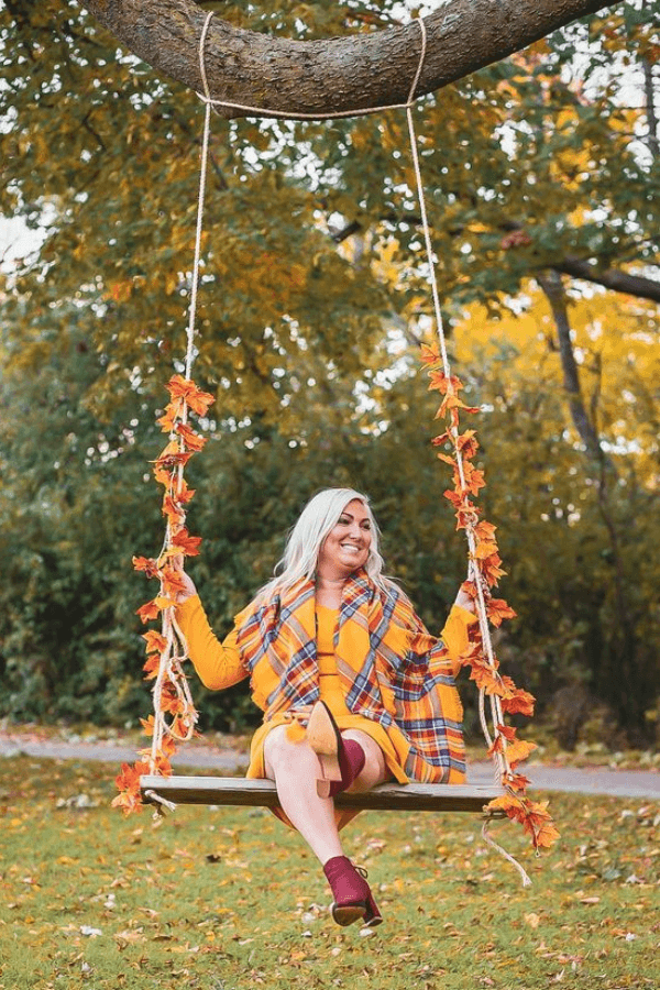 swing with fall leaves wrapped around rope