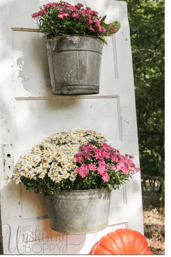 metal cans with flowers