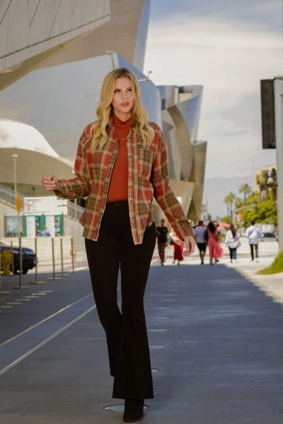 fall cowgirl outfit with orange plaid shirt