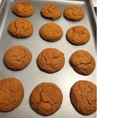 cooked ginger molasses cookies on a pan