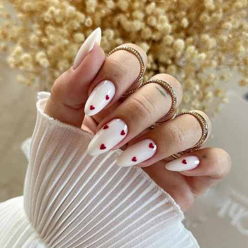 white nails with red hearts