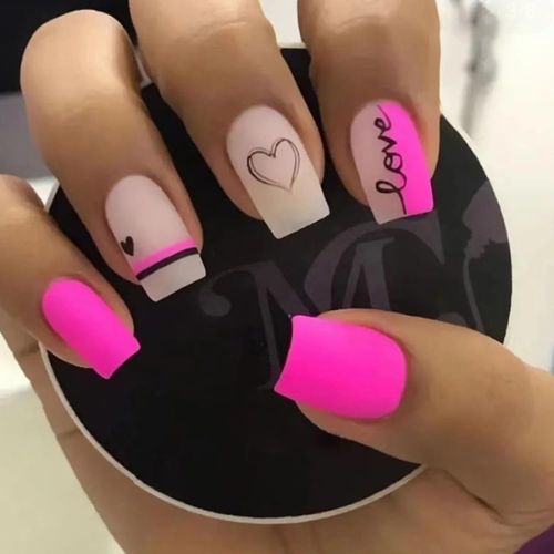 hot pink nails that say love with hearts